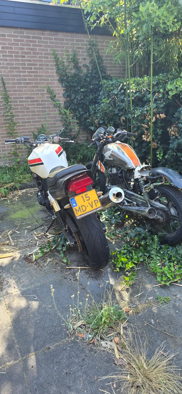 Rear view of donor motorcycles outside